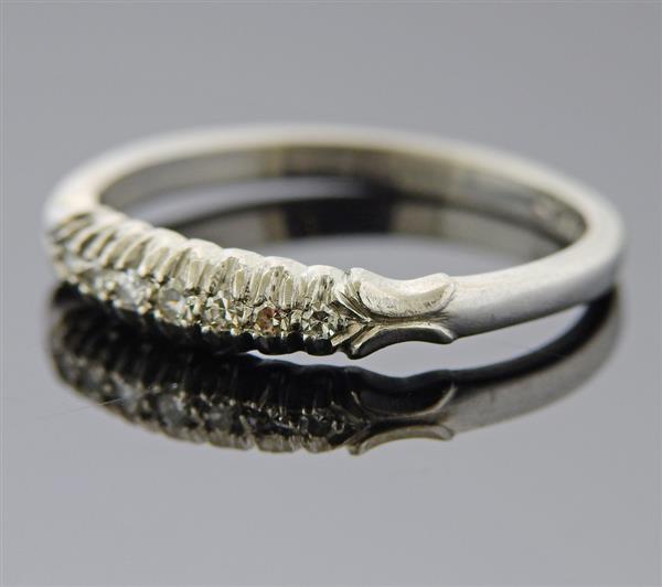 Platinum Diamond Wedding Band Ring: METAL: Platinum. GEMSTONES: Diamonds approx. 0.06ctw. MEASUREMENTS: Ring size 5 1/2, ring band is 3.5mm wide. MARKED: 10%Irid Plat. WEIGHT: 3 grams. Gemstones have not been graded for color and clarit