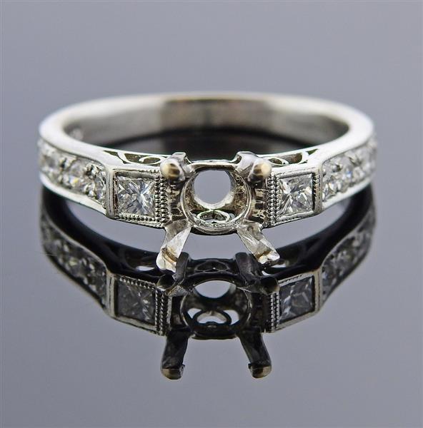 18K Gold Diamond Engagement Ring Mounting: METAL: 18k Gold. GEMSTONES: Diamonds approx. 0.36ctw. Center of the ring will keep approx. 5.6mm x 4.4mm stone. MEASUREMENTS: Ring size 6, ring band is 4.4mm at widest point. MARKED: 18K 750. WEIGHT: