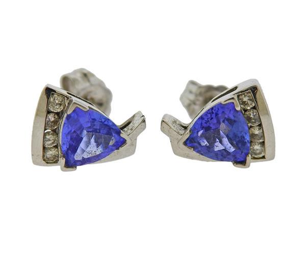 14K Gold Diamond Tanzanite Stud Earrings: METAL: 14k Gold. GEMSTONES: Diamonds approx. 0.20ctw. Tanzanite. MEASUREMENTS: Earrings are 10.5mm x 7.8mm. MARKED: 585 Maker's mark 14k. WEIGHT: 2.6 grams.Gemstones have not been graded for color