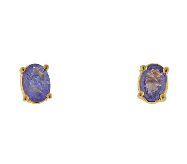 14K Gold Tanzanite Stud Earrings: METAL: 14k Gold. GEMSTONES: Tanzanite - 6mm x 4.2mm (internal imperfections on the stone). MEASUREMENTS: Earrings top 6.3mm x 4.6mm. MARKED: 14k (on backs). WEIGHT: 1 grams.Gemstones have not been gra