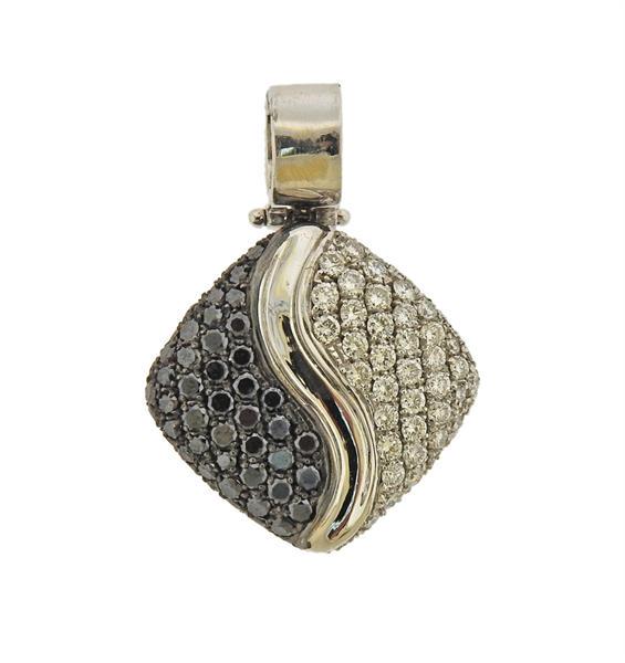 18k Gold Black & White Diamond Pendant: METAL: 18k Gold. MEASUREMENTS: Pendant is 28mm x 20mm. GEMSTONES: Black and white diamonds approx. 1.94ctw. TESTED: 18k. WEIGHT: 7 grams.Gemstones have not been graded for color and clarity ,and teste