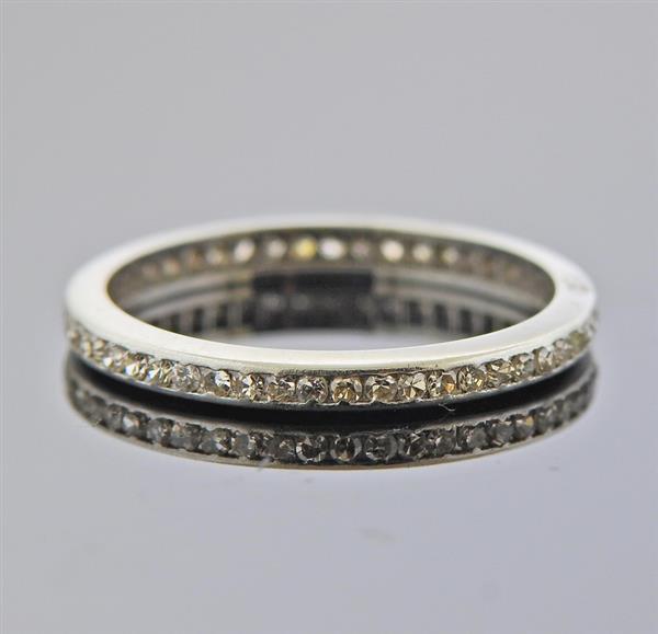 Platinum Diamond Eternity Wedding Band Ring: METAL: Platinum. MEASUREMENTS: Ring size - 6.5, ring is 2.3mm wide. GEMSTONES: Diamonds approx. 0.25ctw. TESTED: Plat. WEIGHT: 2.3 grams.Gemstones have not been graded for color and clarity ,and teste