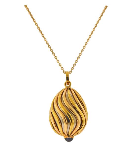 18k Gold Sapphire Pendant Necklace: METAL: 18k Gold. MEASUREMENTS: Necklace is 21" long, pendant - 34mm x 18mm. GEMSTONES: Sapphire. MARKED: FAB, Maker's mark, 750. WEIGHT: 20.4 grams.Gemstones have not been graded for color an