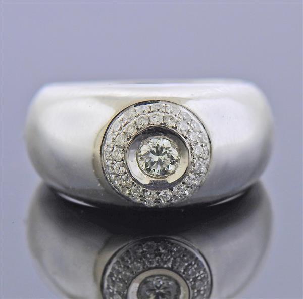 18K Gold Diamond Ring: METAL: 18k Gold. GEMSTONES: Diamonds approx. 0.22ctw. MEASUREMENTS: Ring size 3 1/4, ring top is 9.5mm wide. MARKED: 750. WEIGHT: 7.3 grams.Gemstones have not been graded for color and clarity ,and te