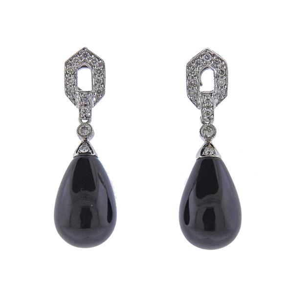 18K Gold Diamond Onyx Drop Earrings: METAL: 18k Gold. GEMSTONES: Diamonds approx. 0.26ctw. Removable drop onyx. MEASUREMENTS: Earrings are 30mm long (missing backs). MARKED: 750, 003. WEIGHT: 5 grams.Gemstones have not been graded for co