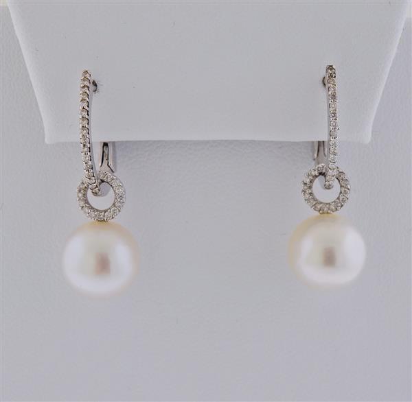 14K Gold Diamond Pearl Day & Night Earrings: METAL: 14k Gold. GEMSTONES: Diamonds approx. 0.16ctw. Pearls - 10.6mm. MEASUREMENTS: Earrings are 32mm long. Removable pearls - 17mm long. TESTED: 14k. WEIGHT: 7 grams.Gemstones have not been graded f