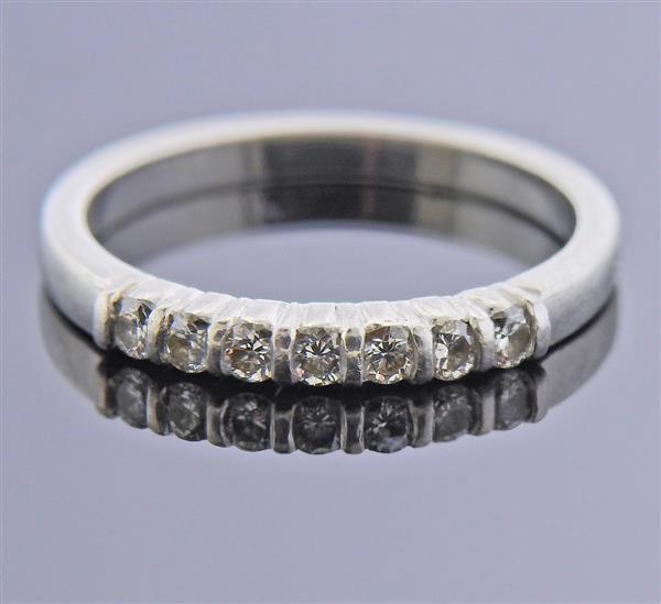 Tiffany & Co Platinum Diamond Band Ring: METAL: Platinum. GEMSTONES: Diamonds approx. 0.21ctw. MEASUREMENTS: Ring size 3 3/4, ring band is 2.1mm wide. MARKED: Tiffany & Co Plat. WEIGHT: 2.6 grams.Gemstones have not been graded for color 