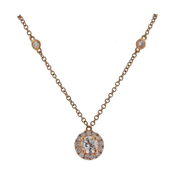 18k Rose Gold Diamond Pendant Necklace: METAL: 18k Rose Gold. MEASUREMENTS: Necklace is 16.5" long, Pendant is 8.5mm in diameter. GEMSTONES: Diamonds approx. 1.06ctw (center approx. 0.47ct H VS). MARKED: 750 on clasp. WEIGHT: 3.4 grams