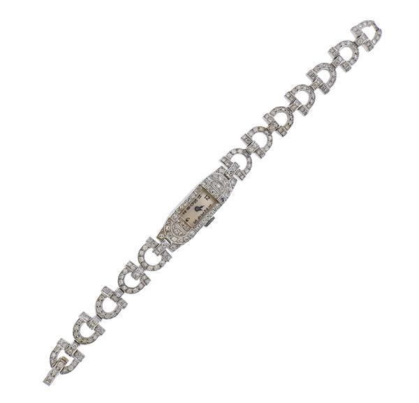 Art Deco 14k Gold Platinum Diamond Lady's Watch: METAL: 14k gold band/Platinum case. MEASUREMENTS: Bracelet is 6" long, Case - 10mm excl crown x 37mm. Band and case decorated with diamonds - approx. 2.00ctw. WEIGHT: 22.7 grams. MOVEMENT: Manual