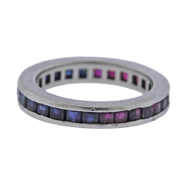 Platinum Sapphire Ruby Band Ring: METAL: Platinum. GEMSTONES: Sapphires and rubies (multiple stones chipped/abraded). MEASUREMENTS: Ring size 5 3/4, ring band is 3.5mm wide (ring shank has dents/needs polishing). TESTED: Plat. WEIGHT:
