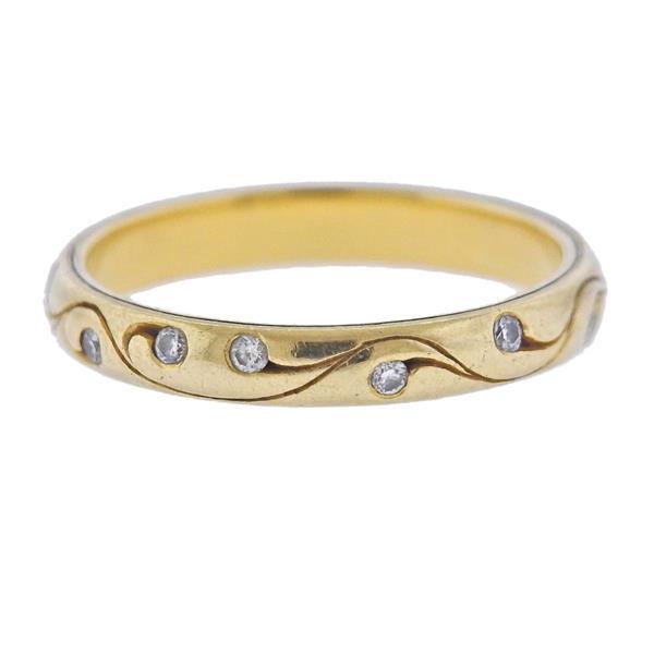 McTeigue 18K Gold Diamond Wedding Bend Ring: METAL: 18k Gold. GEMSTONES: Diamonds approx. 0.10ctw. MEASUREMENTS: Ring size 4 3/4, ring band is 2.8mm wide. MARKED: Maker's mark 750. WEIGHT: 2.5 grams.Gemstones have not been graded for color a