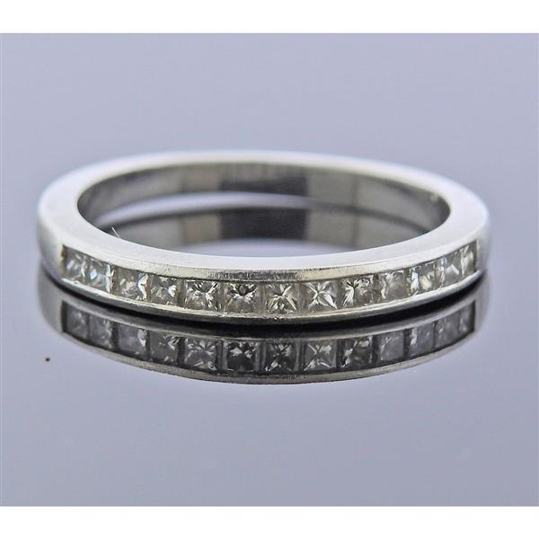 Jeff Cooper Platinum Diamond Wedding Band Ring: METAL: Platinum. GEMSTONES: Diamonds approx. 0.26ctw. MEASUREMENTS: Ring size 5 3/4, ring band is 2.7mm at widest point. MARKED: Jeff Cooper Plat. WEIGHT: 3.4 grams. Ring needs polishing/has dents, sc
