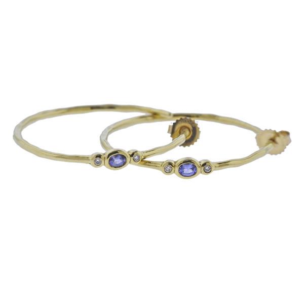 Ippolita 18K Rock Candy Diamond Hoop Earrings: METAL: 18k Gold. GEMSTONES: Diamonds. Iolite. MEASUREMENTS: Earrings are 40mm x 4.5mm at widest point. MARKED: Ippolita 18k. WEIGHT: 9.8 grams.Gemstones have not been graded for color and clarity ,and