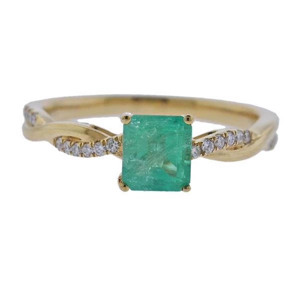 18K Gold Diamond Emerald Ring: METAL: 18k Gold. GEMSTONES: Diamonds approx. 0.16ctw. Emerald - 6.5mm x 5.7mm. MEASUREMENTS: Ring size 8, ring top is 6.5mm wide. MARKED: Iliana . WEIGHT: 3.8 grams.Gemstones have not been graded for 
