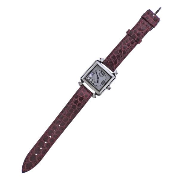 Chopard Happy Sport Diamond Steel lady's Watch: METAL: Stainless Steel. MEASUREMENTS: Case - 27 x 35mm. Original Chopard leather band and steel buckle, band is 7.25" long. Signature floating diamonds on the dial - approx. 0.35ctw. MOVEMENT: Qu