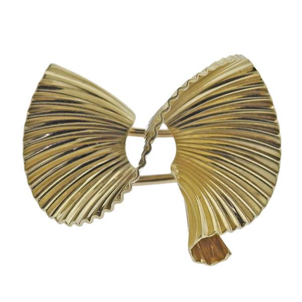 McTeigue Mid Century 14K Gold Brooch Pin: METAL: 14k Gold. GEMSTONES: n/a. MEASUREMENTS: Brooch is 29mm x 22mm. MARKED: Maker's mark MT, B1844, 14k. WEIGHT: 6.3 grams.Gemstones have not been graded for color and clarity ,and tested for cl