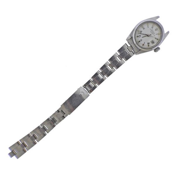 Rolex Oyster Date Steel Lady's Watch ref. 6916: METAL; Stainless Steel. MEASUREMENTS: Case 26mm, oyster band is detached on one end, with end link/no pin. Bend shows stretching. Whit dial with Roman and square gold markers. MOVEMENT: Automatic, wor