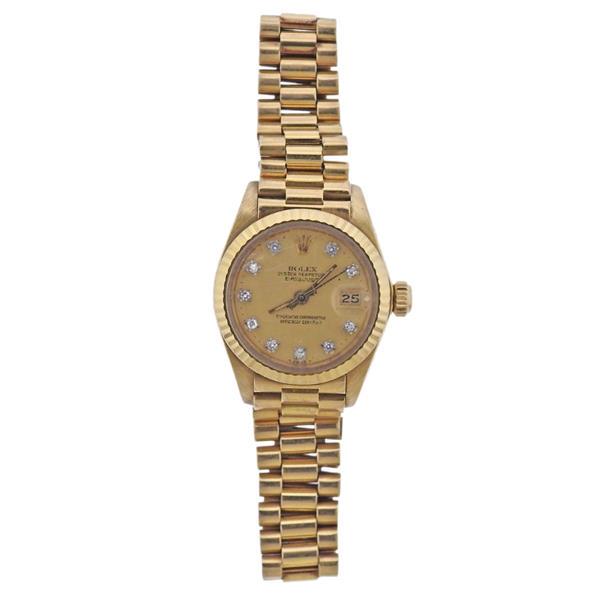 Rolex Datejust 18k Gold Diamond Lady's Watch 6917: METAL: 18k Gold. MEASUREMENTS: Case 26mm in diameter, 18k gold band with deployant buckle. Will fit approx. 7" wrist. Gold tone dial with diamond markers. Scratches on crystal, case , band. MOVEM