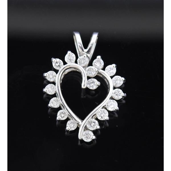14k Gold Diamond Heart Pendant: METAL: 14k Gold. MEASUREMENTS: Pendant is 26mm x 17mm. GEMSTONES: Diamonds approx. 0.90ctw. MARKED: AV 14k. WEIGHT: 4.1 grams.Gemstones have not been graded for color and clarity ,and tested for clari