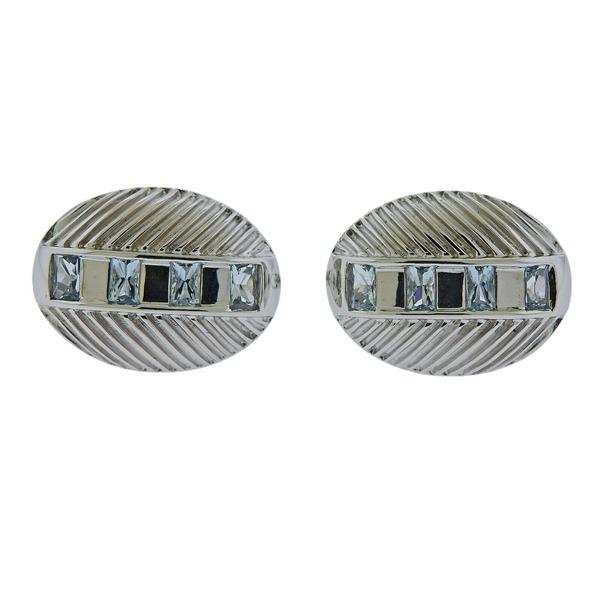 Gwennie Tam Armadillo Aquamarine Gold Cufflinks: METAL: 18k Gold. MEASUREMENTS: Top is 23 x 18mm. GEMSTONES: Aquamarine 1.42ctw. Retail $2430. MARKED: Gwenie Tam, 750, 1.42. WEIGHT: 18.2 grams.Gemstones have not been graded for color and clarity ,an