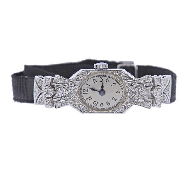 Art Deco Platinum Diamond Lady's Watch: METAL; Platinum. MEASUREMENTS: Case 13mm x 46mm lug end to end, fabric band and gold buckle. MOVEMENT: Manual wind, working order. WEIGHT: 12.5 grams.Watches are guaranteed to be in running order, if 