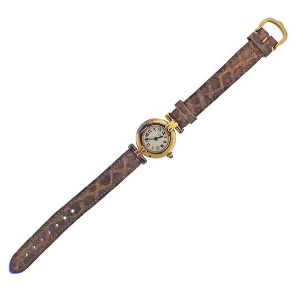 Must de Cartier Vermeil Watch: METAL; Vermeil. MEASUREMENTS: Case 24mm, bracelet is 7.5" long. Patina/oxidation present on the case. Cartier eggshell dial with black Roman markers. MOVEMENT: Quartz, not working.Watches are gua