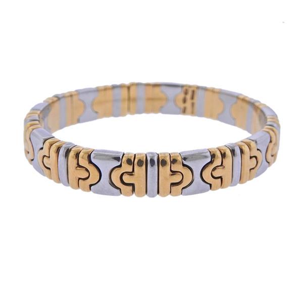 Bvlgari Bulgari Parentesi 18k Gold Steel Bracelet: METAL: 18k Gold/ Stainless Steel. MEASUREMENS: Bracelet will fit approx. 6.5-6.75" wrist, width 9mm. MARKED: Or Acier, S, 750, Bvlgari. WEIGHT: 40.5 grams.Gemstones have not been graded for color