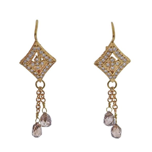 18k Gold Diamond Topaz Earrings: METAL: 18k Gold. GEMSTONES: Diamonds approx. 0.37ctw. Topaz. MEASUREMENTS: Earrings are 42mm x 13mm (backs are not secure/needs adjusting). TESTED: 18k. WEIGHT: 5.3 grams.Gemstones have not been grade