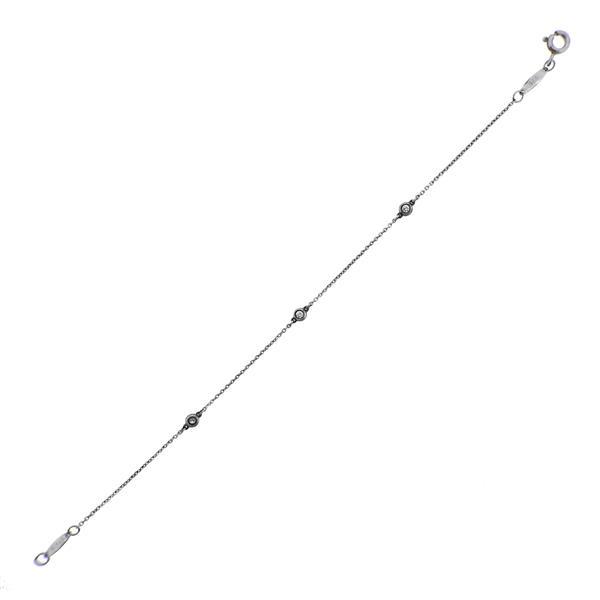 Tiffany & Co Peretti Diamonds by the Yard Silver Bracelet: METAL: Sterling Silver. MEASUREMENTS: Bracelet is 7.25" long, diamond stations are 3.6mm in diameter. GEMSTONES: Diamonds approx. 0.09ctw. MARKED: Peretti, Tiffany & Co, 925, Spain. WEIGHT: 1