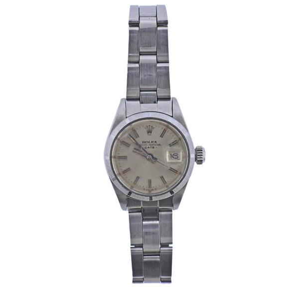 Rolex Oyster Date Steel Lady's Watch 6919: METAL: Stainless Steel. MEASUREMENTS: Case 26mm, oyster band will fit approx. 6.5" wrist. Silvered dial with stick markers, date at 3 o'clock. Rust on hands. MOVEMENT: Automatic, working orde