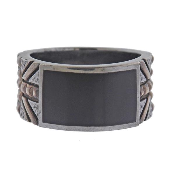Stephen Webster Onyx Alchemy in the UK Union Jack Band Ring: METAL: Sterling silver. GEMSTONES: Onyx. MEASUREMENTS: Ring size 10 3/4, ring top is 12.3mm wide. MARKED: Stephen Webster 925. WEIGHT: 16.1 grams.Gemstones have not been graded for color and clarity ,