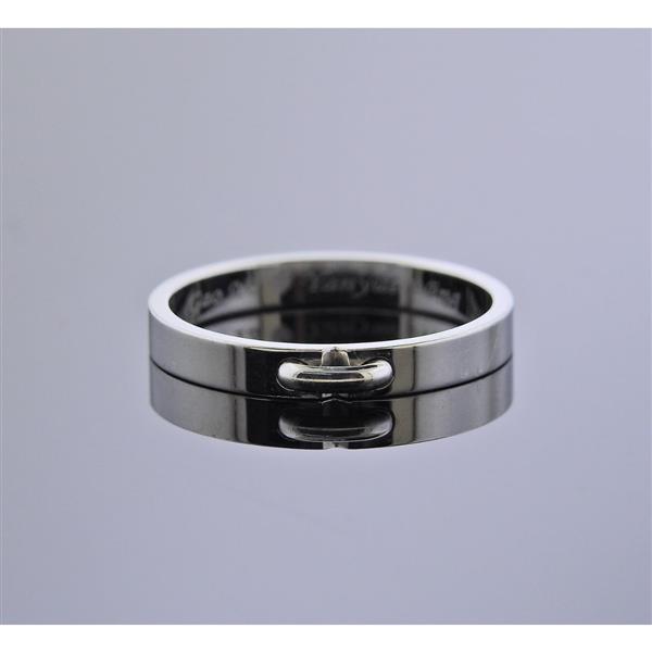 Chaumet Platinum Band Ring: METAL: Platinum. MEASUREMENTS: Ring size 8 3/4, ring band is 3mm wide. MARKED: Chaumet Pt950, 1864042, 59, Engraved. WEIGHT: 4.9 grams.Gemstones have not been graded for color and clarity ,and tested