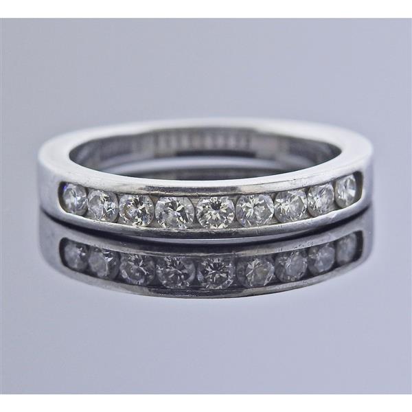 Platinum Diamond Wedding Band Ring: METAL: Platinum. MEASUREMENTS: Ring size 6, ring is 3.4mm wide. GEMSTONES: Diamonds approx. 0.45ctw. MARKED: Ga, pt950. WEIGHT: 5.4 grams.Gemstones have not been graded for color and clarity ,and test