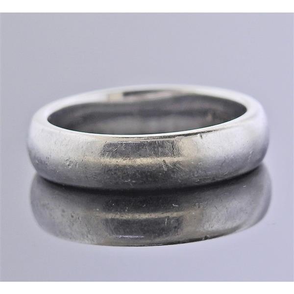 Tiffany & Co Platinum Wedding Band Ring: METAL: Platinum. MEASUREMENTS: Ring size 5 1/4, ring band is 4.6mm wide (ring needs polishing). MARKED: Tiffany & Co PT950. WEIGHT: 8.3 grams.Gemstones have not been graded for color and clarity ,