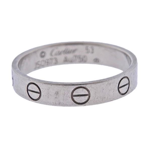 Cartier Love 18k Gold Band Ring Sz 53: METAL: 18k Gold. MEASUREMENTS: Ring size 6 1/2, ring band is 3.6mm wide. MARKED: Cartier 53, JSO973 Au750. WEIGHT: 3.4 grams. Retail $1250.Gemstones have not been graded for color and clarity ,and tes