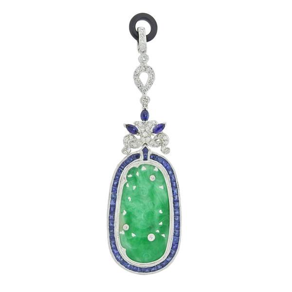 18k Gold Diamond Sapphire Carved Jade Pendant: METAL: 18k Gold. GEMSTONES: Diamonds approx. 0.34ctw. Sapphire. Carved jade. MEASUREMENTS: Pendant is 72mm long x 22mm wide. TESTED: 18k. WEIGHT: 9.7 grams.Gemstones have not been graded for color and