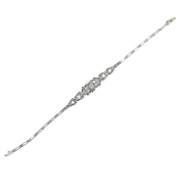 Antique 18k Gold Platinum Diamond Bracelet: METAL: 18k Gold/ Platinum. MEASUREMENTS: Bracelet is 7" long x 9mm wide. GEMSTONES: Diamonds approx. 0.50ctw. TESTED: 18k/Plat. WEIGHT: 7.8 grams.Gemstones have not been graded for color and clar