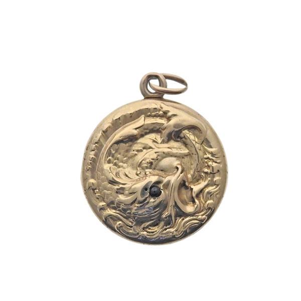 Antique Gold Serpent Locket Pendant: METAL: 10k Gold. MEASUREMENTS: Pendant is 23mm in diameter. GEMSTONES: Garnet. TESTED : 10k, initialed back. WEIGHT: 5.1 grams.Gemstones have not been graded for color and clarity ,and tested for clar