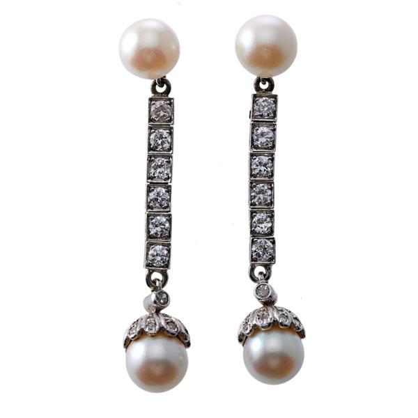 Platinum 14k Gold Diamond Pearl Drop Earrings: METAL: Platinum/14k Gold. GEMSTONES: Diamonds approx. 0.80ctw. Pearl - 8-8.2mm. MEASUREMENTS: Earrings are 50mm long. TESTED: Plat/14k earrings, Marked - 14k backs. WEIGHT: 9.6 grams.Gemstones have no