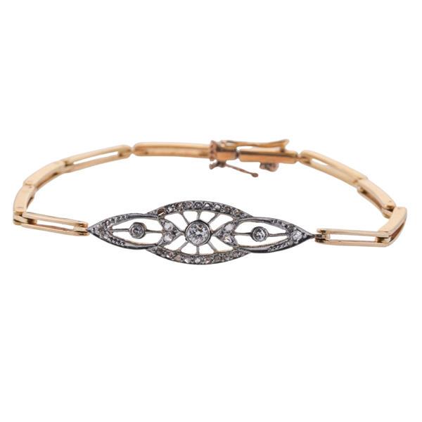 Antique 18k Gold Platinum Diamond Bracelet: METAL: 18k Gold/. GEMSTONES: Mixed old mine and rose cut diamonds approx. 30 stones (one stone is missing). MEASUREMENTS: Bracelet is 6.5" long x 9mm wide in center section (safety chain needs ad
