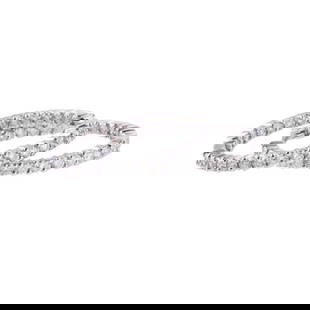Roberto Coin 18k Gold Inside Out Diamond Hoop Earrings: METAL: 18k Gold. GEMSTONES: Diamonds approx. 3.00-3.20ctw. MEASUREMENTS: Earrings are 32mm x 2.5mm. MARKED: Roberto Coin Ruby Mark 18k, Star mark 1226VI. WEIGHT: 10 grams. Retail 7900.Gemstones have n