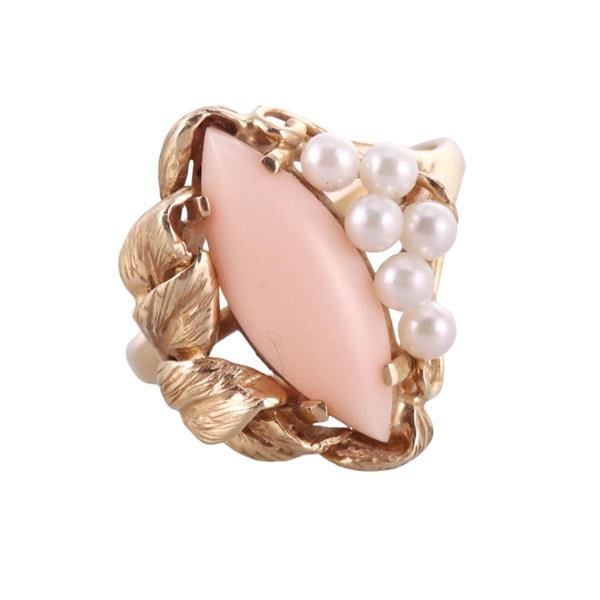 Mid Century 18k Gold Angel Skin Coral Pearl Ring: METAL: 18k Gold. GEMSTONES: Coral. Pearls. MEASUREMENTS: Ring size 8 1/4, top is 21mm. MARKED: Invisible gold mark - 18k. WEIGHT: 6.2 grams.Gemstones have not been graded for color and clarity, and te