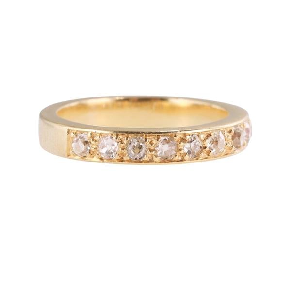 18k Gold Diamond Band Ring: METAL: 18k Gold. GEMSTONES: Diamonds approx. 0.30ctw. MEASUREMENTS: Ring size 6 3/4, band is 3.5mm. MARKED: 750 Maker's mark on the outside of the shank. WEIGHT: 5.6 grams.Gemstones have not been 