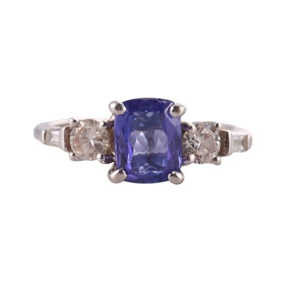 18k Gold Diamond Sapphire Engagement Ring: METAL: 18k Gold. GEMSTONES: Diamonds approx. 0.50ctw. Sapphire - 7.6mm x 6mm (with some small chips). MEASUREMENTS: Ring size 6, top is 7.4mm. MARKED: Illegible Maker's mark, 18k 750. WEIGHT: 3.8 