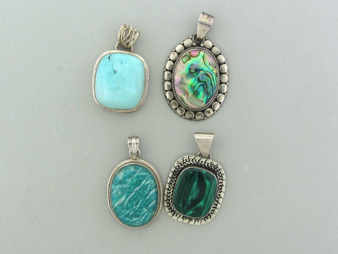 086: 4 pc Lot Sterling Silver Gemstone Pendants: Abalone,Malachite,Turquoise,Gemstone. Pendant 1 - 48mm x29mm Pendant 2 - 55mm x 34mm Pendant 3 - 45mm x 27mm Pendant 4 - 50mm x 28mm Total Weight 4 Pendants - 87.5 grams.