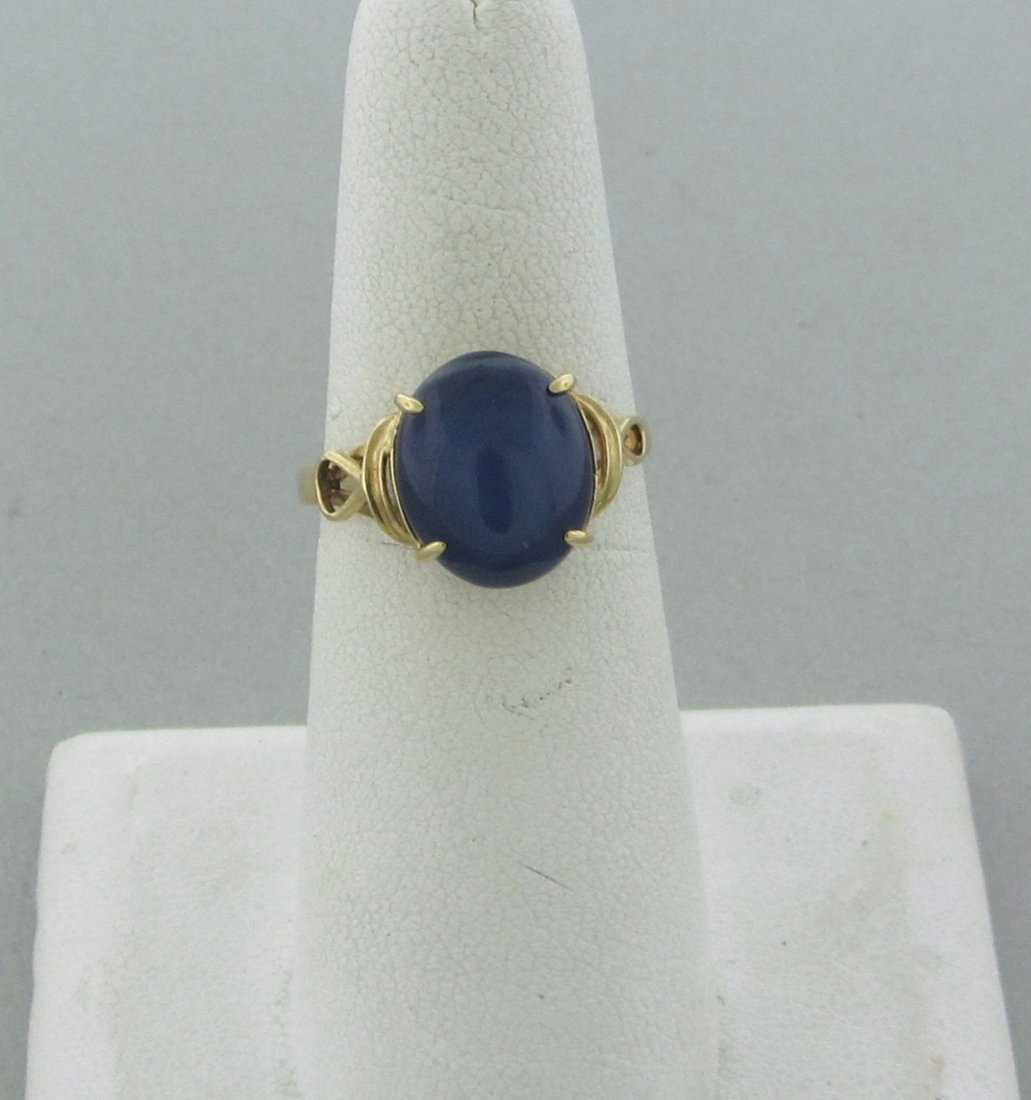 18k Gold Lindy Star Sapphire Ring: Measurements - ring size 6 3/4, ring is 11mm wide. sapphire - 11mm x 9.5mm. weight - 2.5 grams.