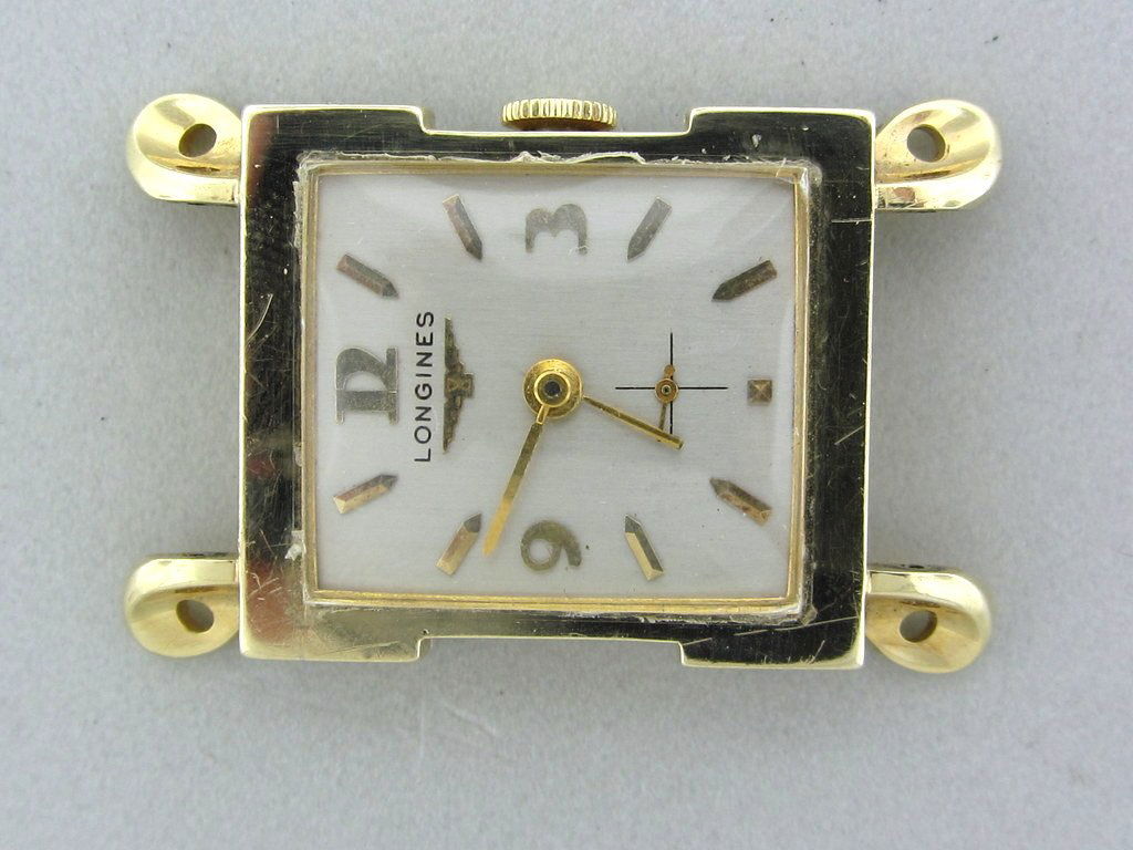 Mens's Vintage 14k Gold Longines w Fancy Case: 14k Yellow gold case with heavy fancy lugs , 42mm long X 27mm at the widest point. Silvered dial with applied gold markers. Manual wind movement 17jewels. cal. 9LT. Case , movement and dial signed by