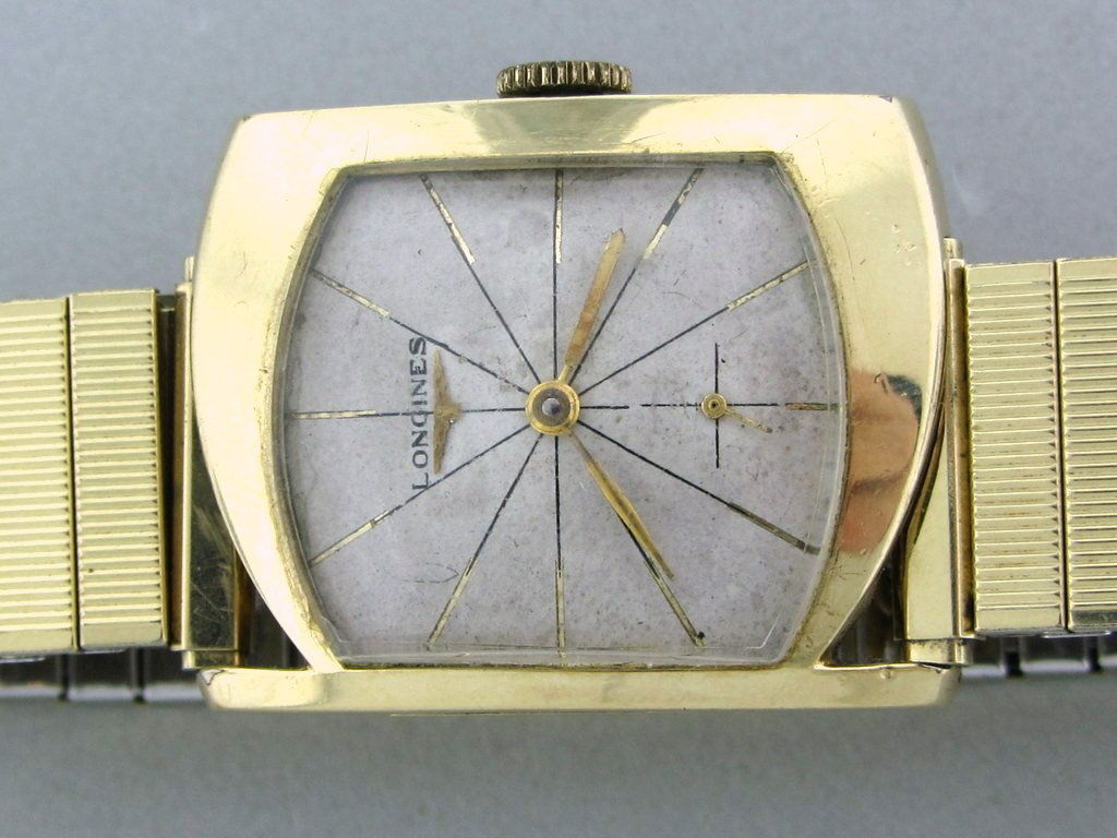 Men's Vintage Longines Accymetrical Watch: 10k g.f. case 32mm X 25mm , 17jewels manual wind movement, cal 370. . small second hans. tripple signed.