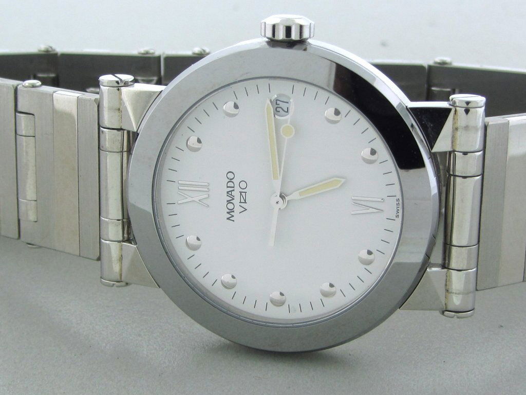 Movado Vizio Men's Watch on Steel Bracelet: Case: Steel Dial: White Hands: Original Crystal: Sapphire crystal Watchband: Steel. Movement: Quartz.