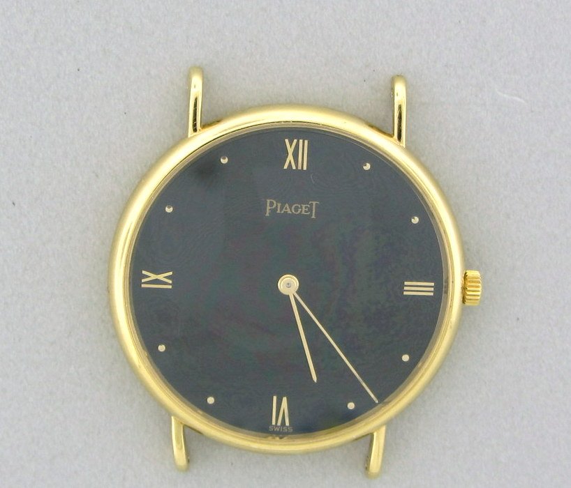 PIAGET 18k Gold Men's Watch: Case: 18k yellow gold held by 4 screws. Dial: Black. Starp: N/A Movement: Quartz